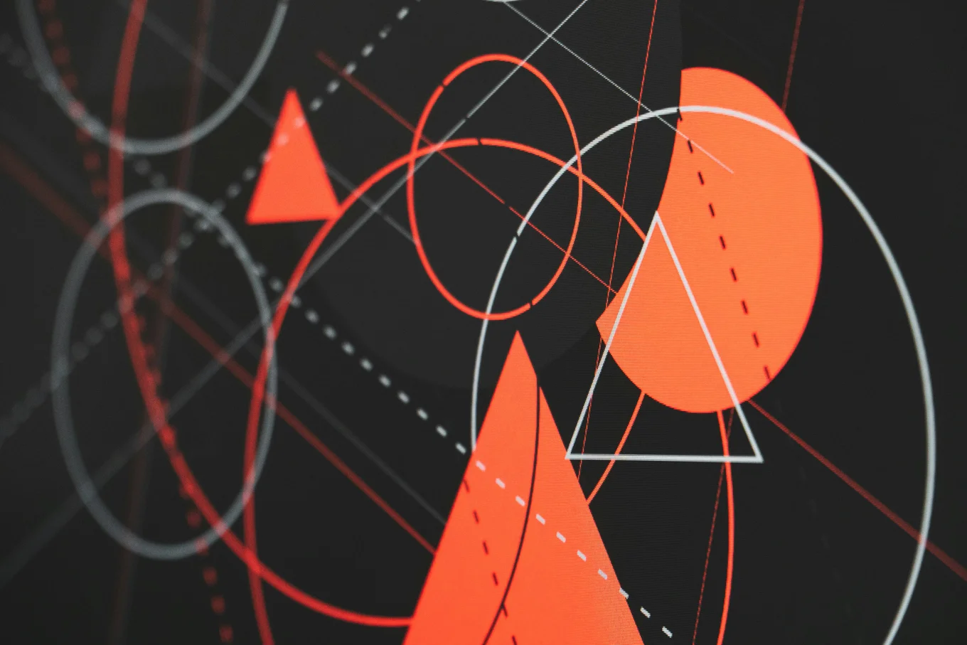 An abstract pattern of white and red circles, triangles, lines, and dotted lines against a dark grey/black background.